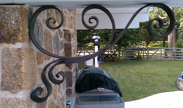Forged and acid blackened stainless steel decorative support